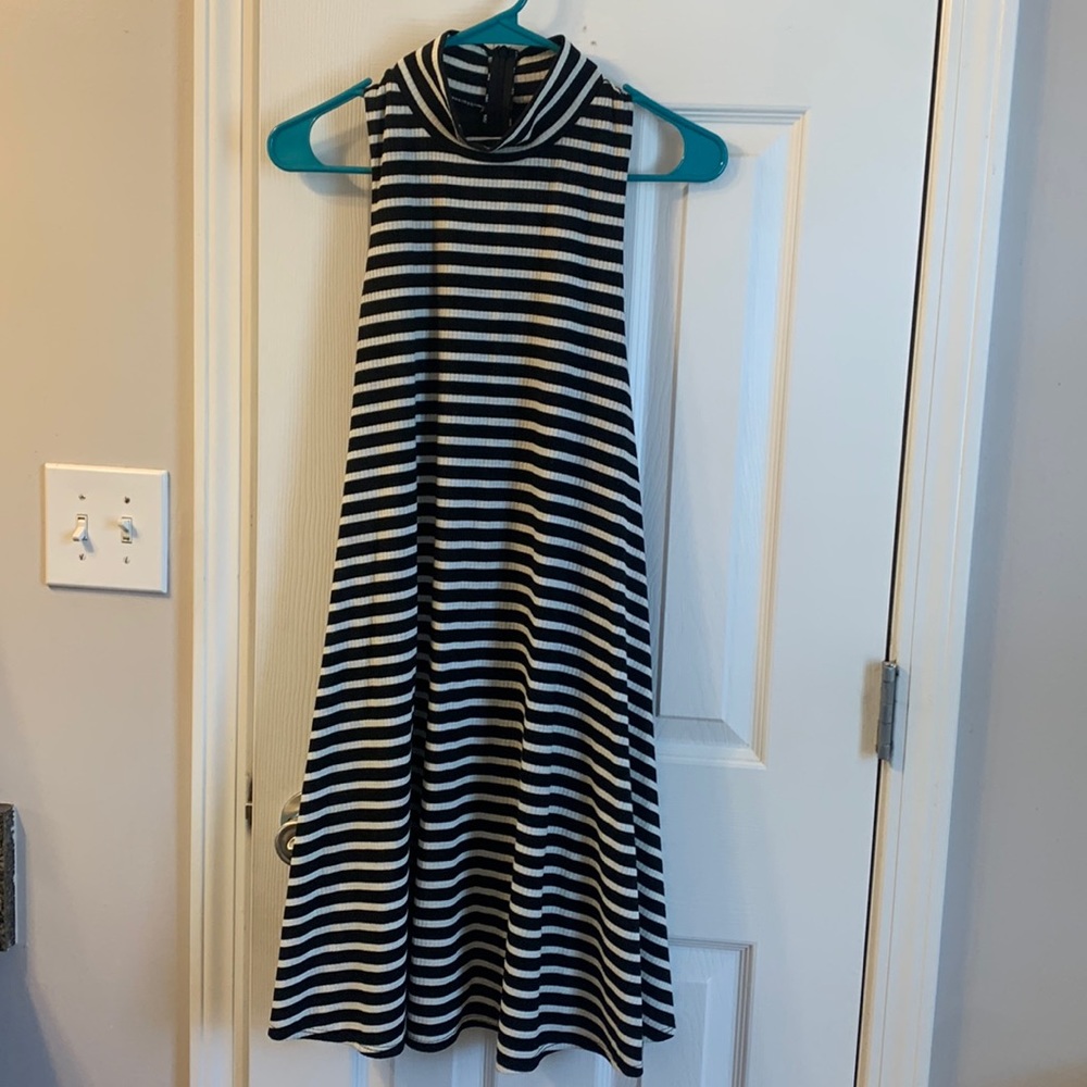 Large, black and white stipe turtleneck dress